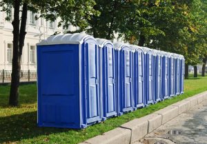 line of porta potties near an apartment