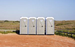 porta potties in an open lot