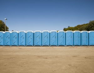 line of porta potties on a lot