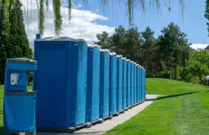 line of porta potties at a park