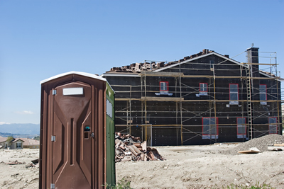 portable toilet at a new home construction site